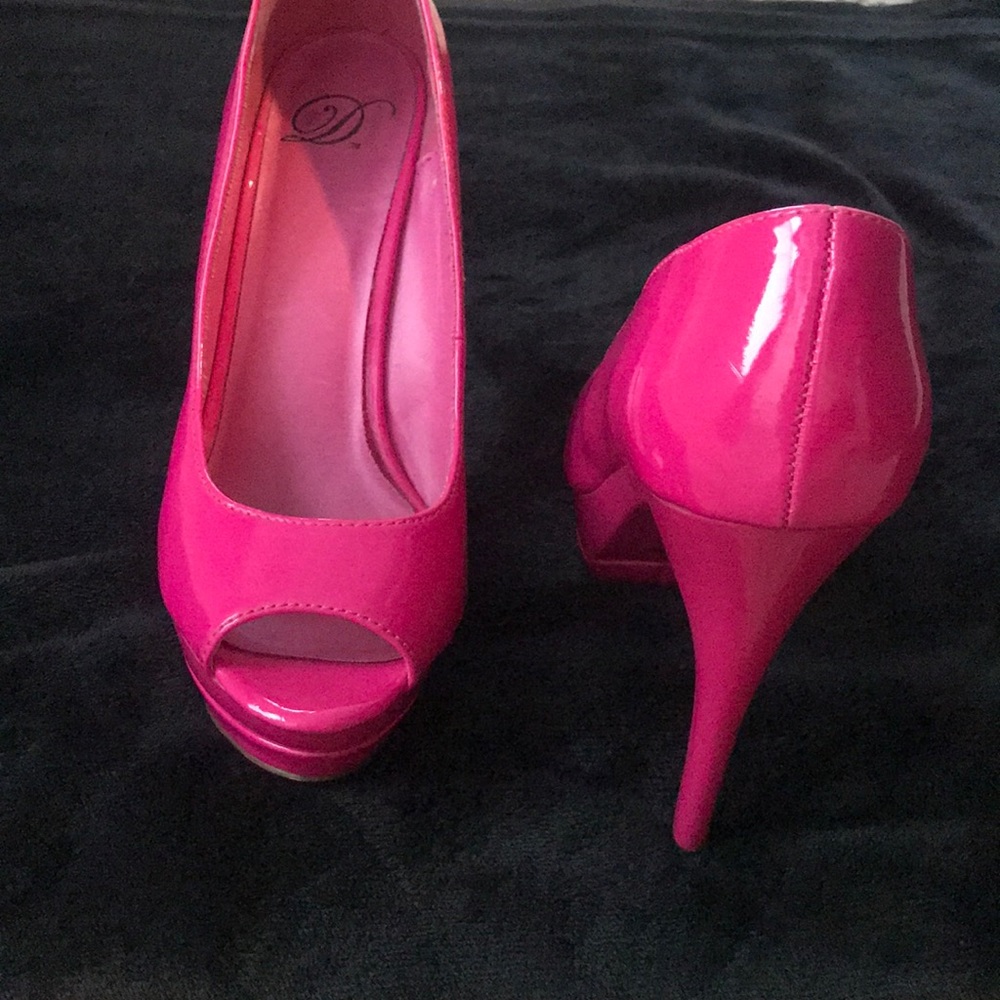 Rarely used bright pink high heels